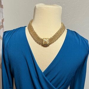 Elegant Golden Tone  Chain Necklace With a Matching Bracelet .